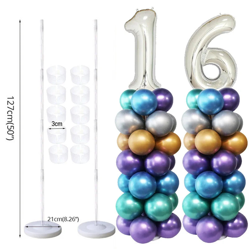A tall plastic column stand holding a cluster of iridescent balloons in various shades of blue, purple, and gold.