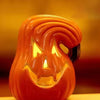 An orange glowing Halloween pumpkin lantern with a carved face is displayed on a wooden surface.