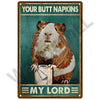 A portrait of a brown and white rabbit wearing a sign that reads Your Butt Napkins and My Lord
