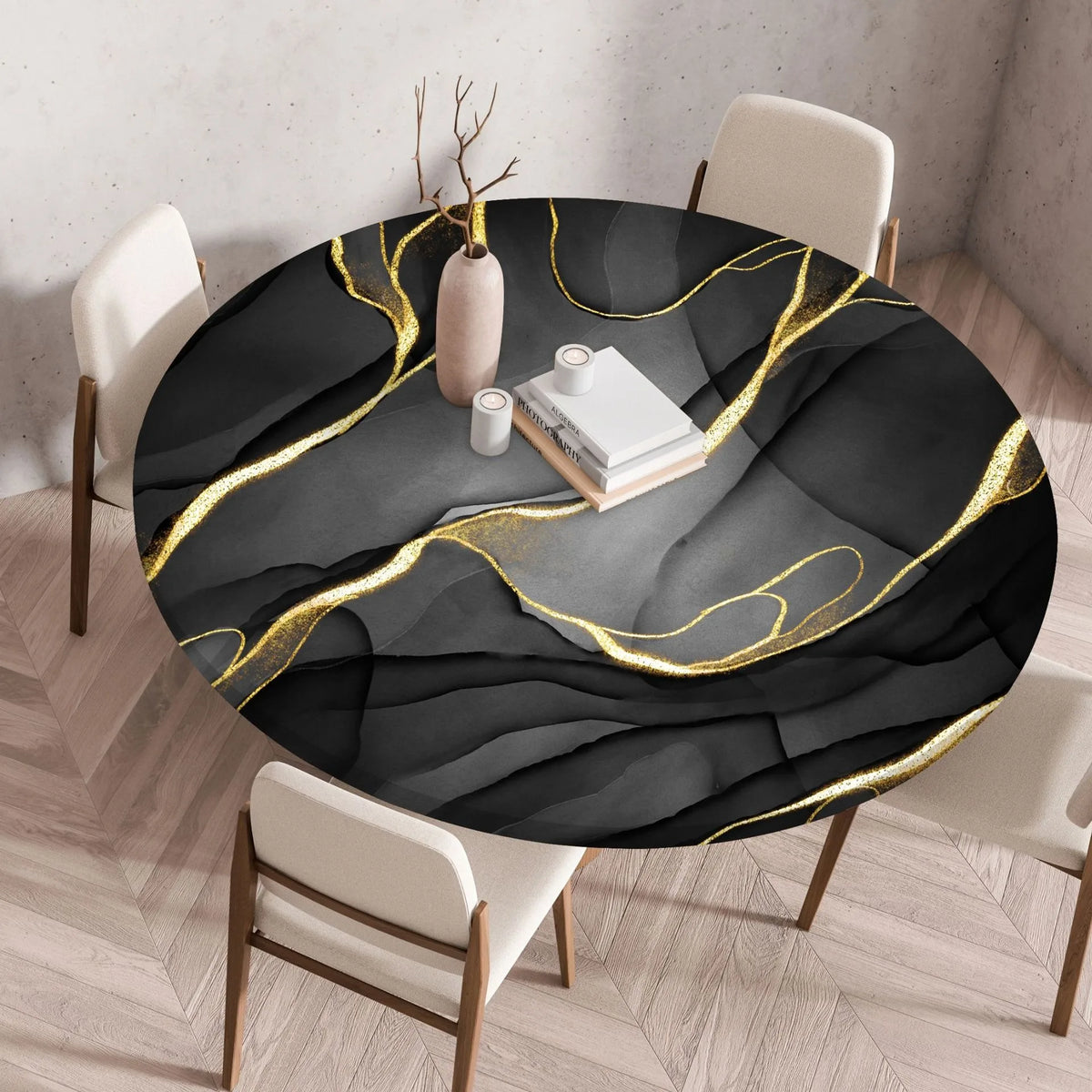 A round black tablecloth with gold marble print veins is displayed on a table in a modern room.