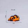An orange and black mini monster spider figurine with a skeleton design.