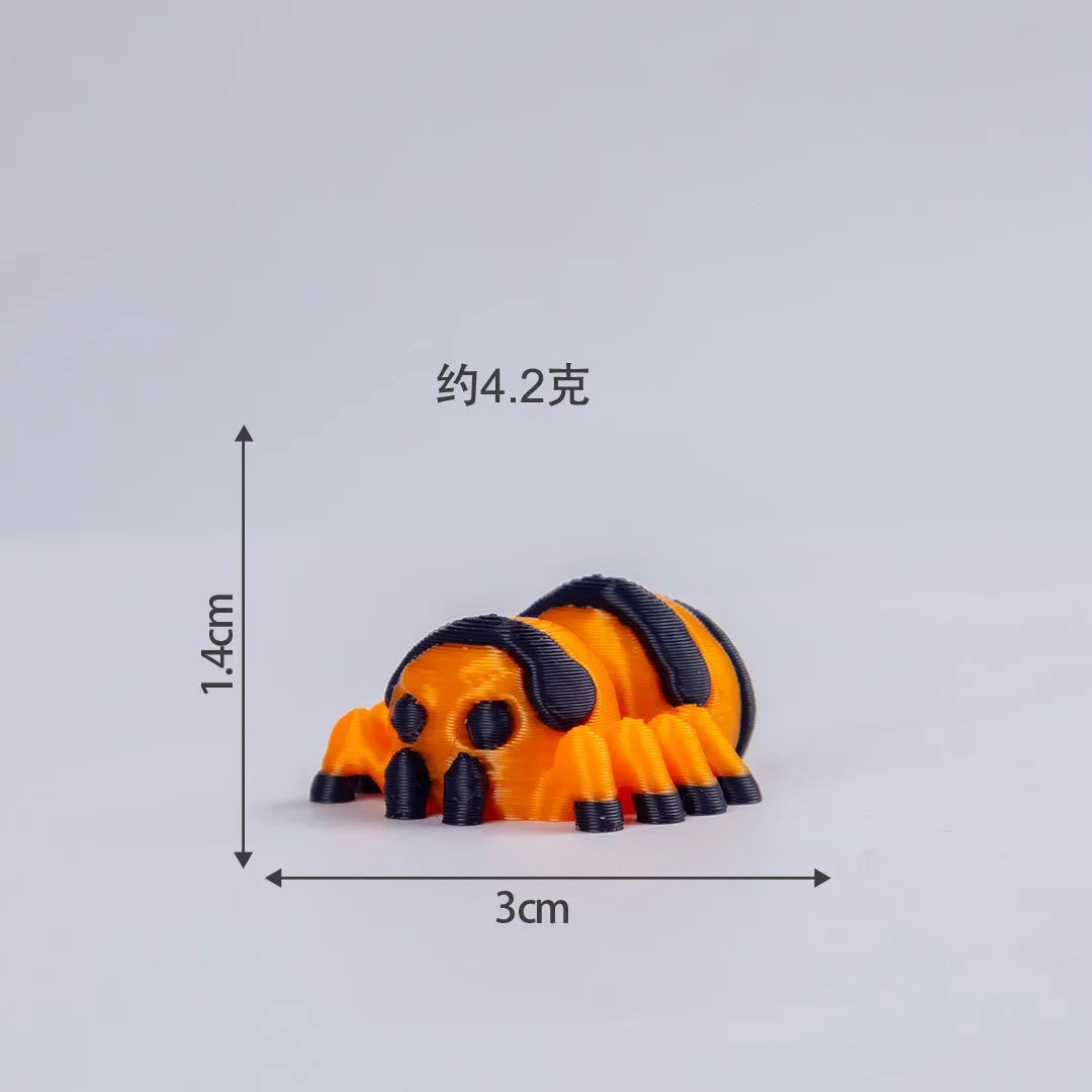 An orange and black mini monster spider figurine with a skeleton design.
