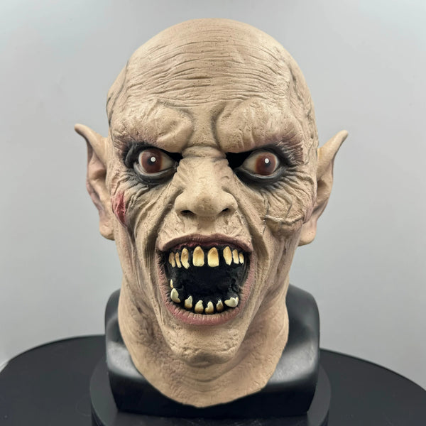A realistic demon latex mask featuring wrinkled skin and sharp teeth for Halloween