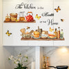Wall decals featuring butterflies and kitchen decor elements like spices, tea pots, and food items on a white cabinet.