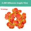A circular garland made of 60 artificial maple leaves in shades of orange and red on 12 strings.