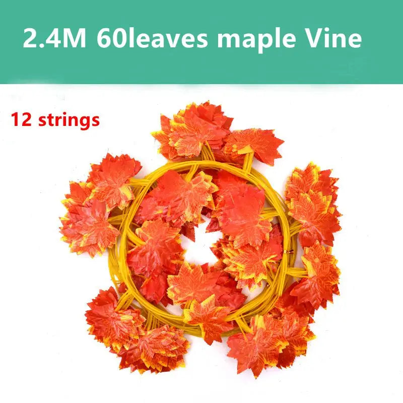 A circular garland made of 60 artificial maple leaves in shades of orange and red on 12 strings.