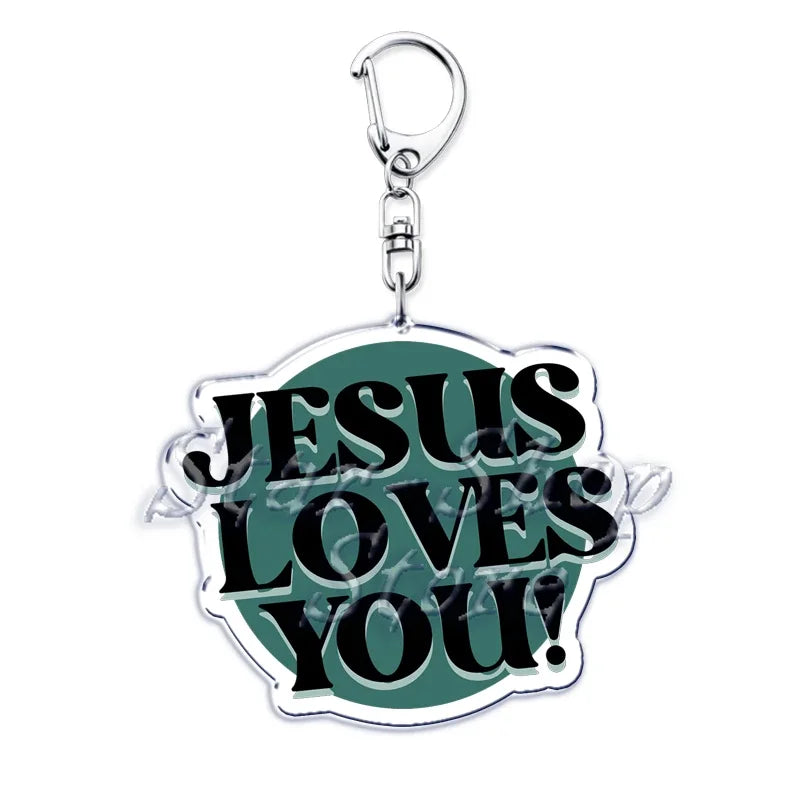 Silberner Acryl-Anhänger mit der Aufschrift Jesus liebt dich, umgeben von einem grünen Blattdesign.