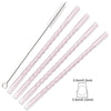 A set of clear pink borosilicate glass straws with cleaning brushes.