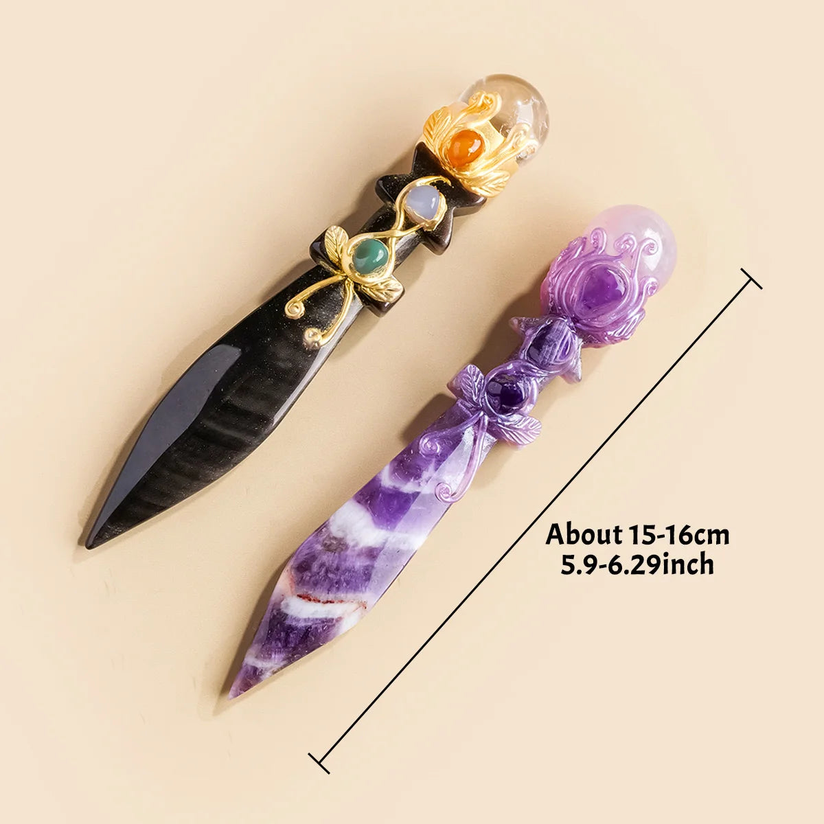 A decorative piece featuring an amethyst and obsidian crystal ball with gold accents.