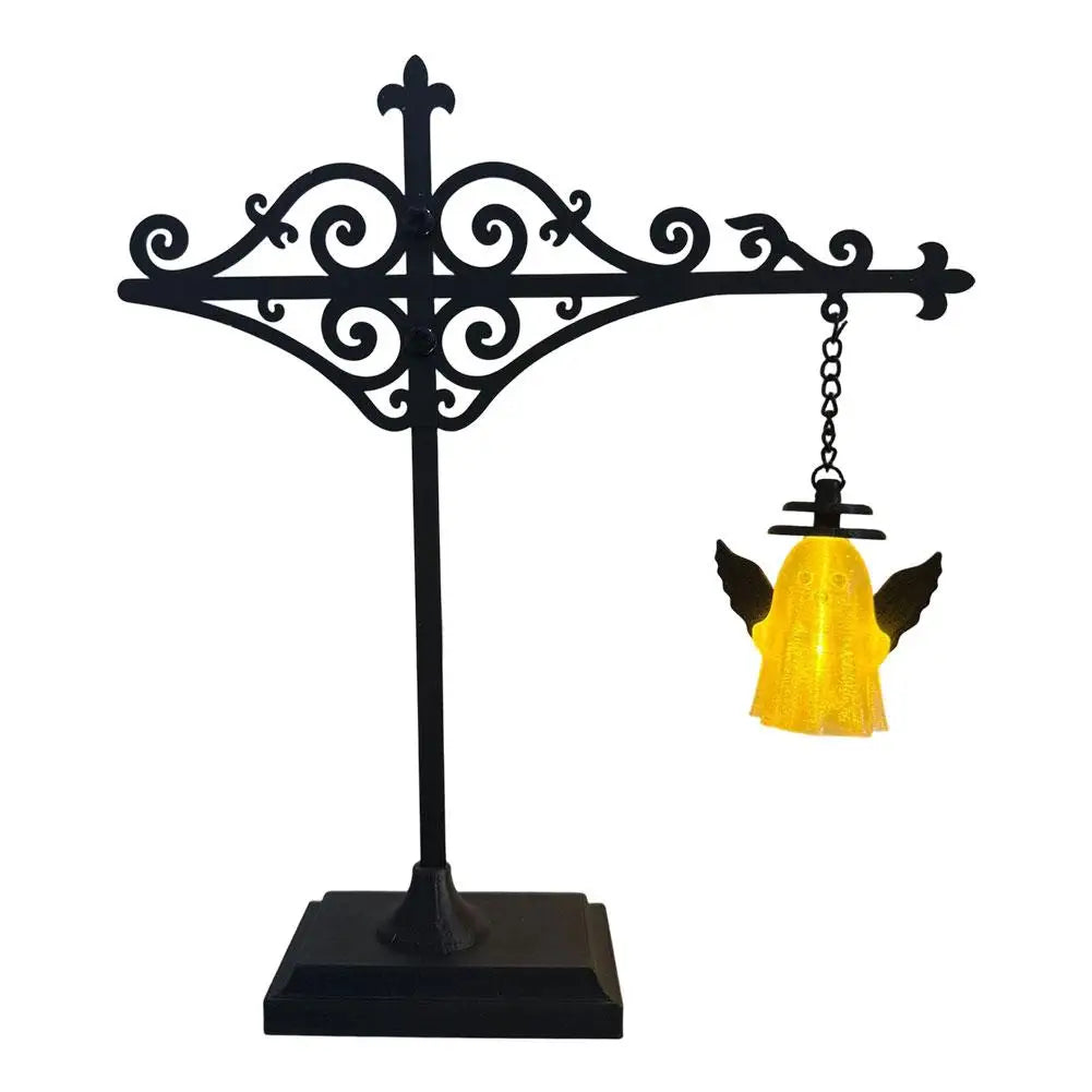 Black wrought iron mini book nook decor lamp with a soft warm glow