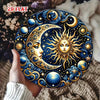 A round metal wall sign featuring a detailed golden sun and crescent moon against a deep blue starry background.