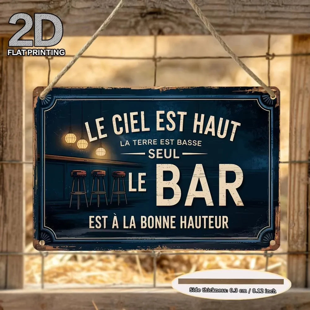 A vintage metal tin sign with text that reads Le ciel est haut la terre est basse le bar est à la bonne hauteur, displayed on