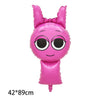 Pink balloon shaped like a bunny head with large black eyes and pink ears