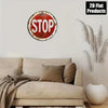 Vintage metal round stop sign wall decor mounted on a white wall above a beige sofa.