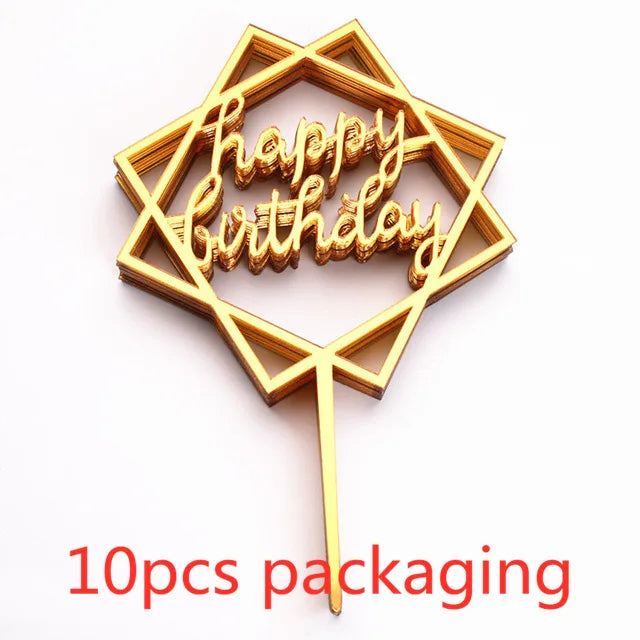 A gold acrylic love happy birthday cake topper in a six-pointed star shape with the words Happy Birthday on it, shown against