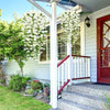 Artificial morning glory hanging vine with white flowers decorating a porch railing