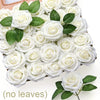 A cluster of white foam rose flower heads with green leaves arranged on a wooden board.