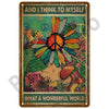 Vintage metal tin sign featuring a peace sign flower design with text that reads And I Think to Myself What a Wonderful World
