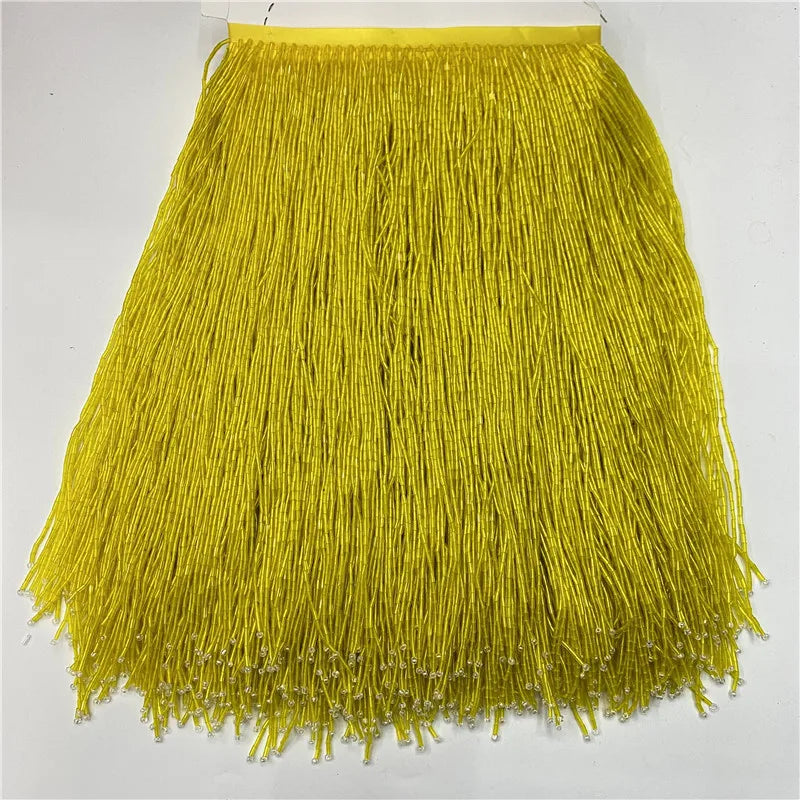 Bright yellow decorative beaded tassel fringe trim for curtains and DIY projects