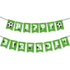 A banner decoration for a birthday party featuring soccer ball themed pennants in green and yellow.