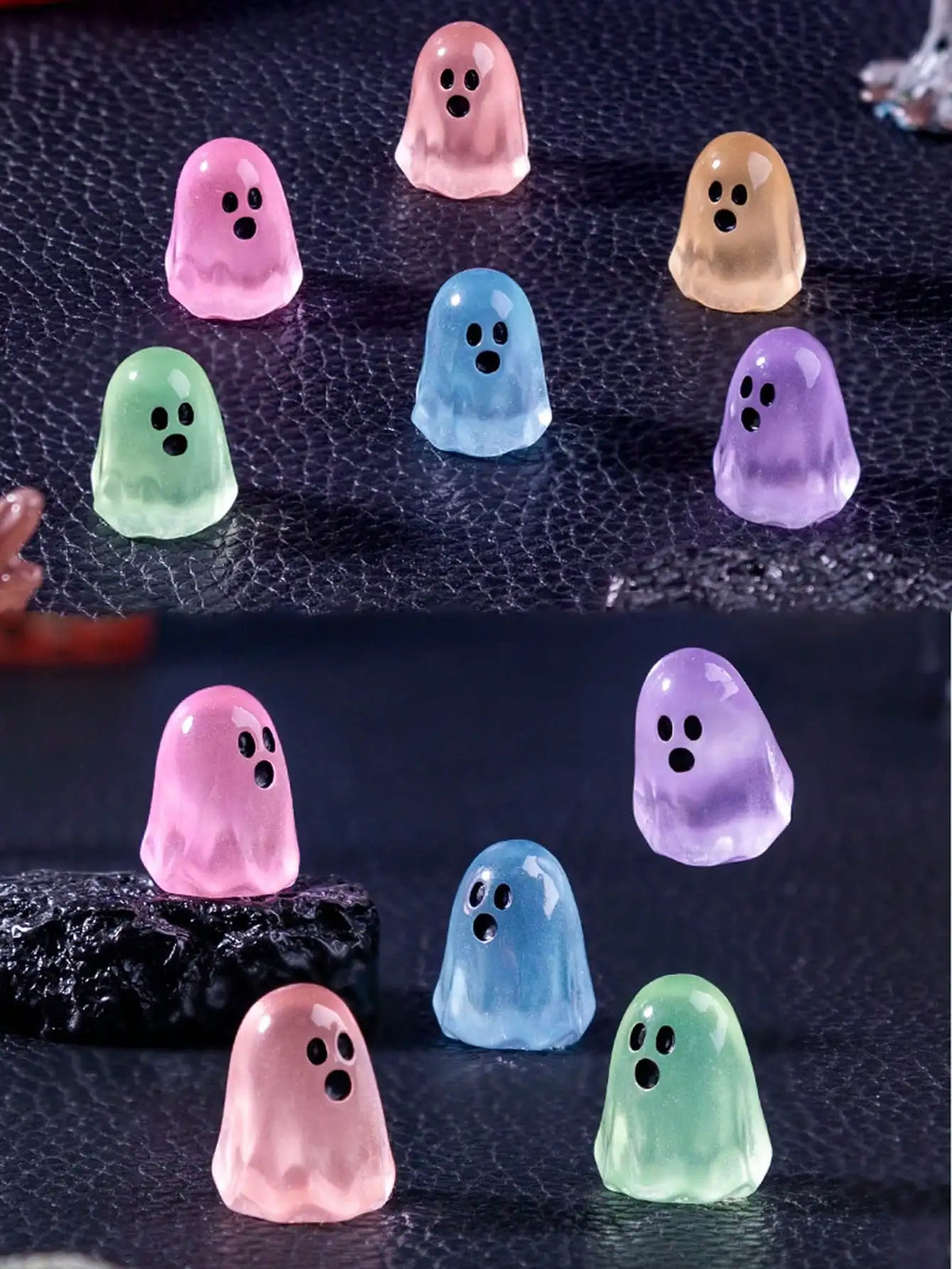 A collection of luminous ghost mini figurines in various pastel colors including pink, purple, green, and yellow.