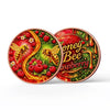 A round copper art bar featuring a bee and raspberry design with a protective case.