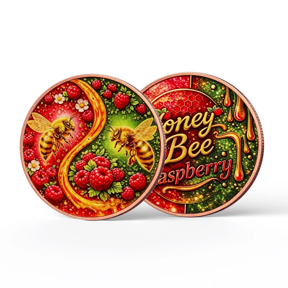 A round copper art bar featuring a bee and raspberry design with a protective case.