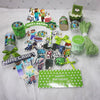 A collection of Minecraft-themed party supplies including flag pulling cake toppers, decorations, and tableware.