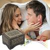 A woman and a man are looking at an antique wood music box with engraved melody.