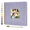 A purple linen cover scrapbook album with a gold spiral binding and a photo of a couple.