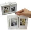 A white 3D rotating photo holder with two clear display pockets is shown being held by a hand.