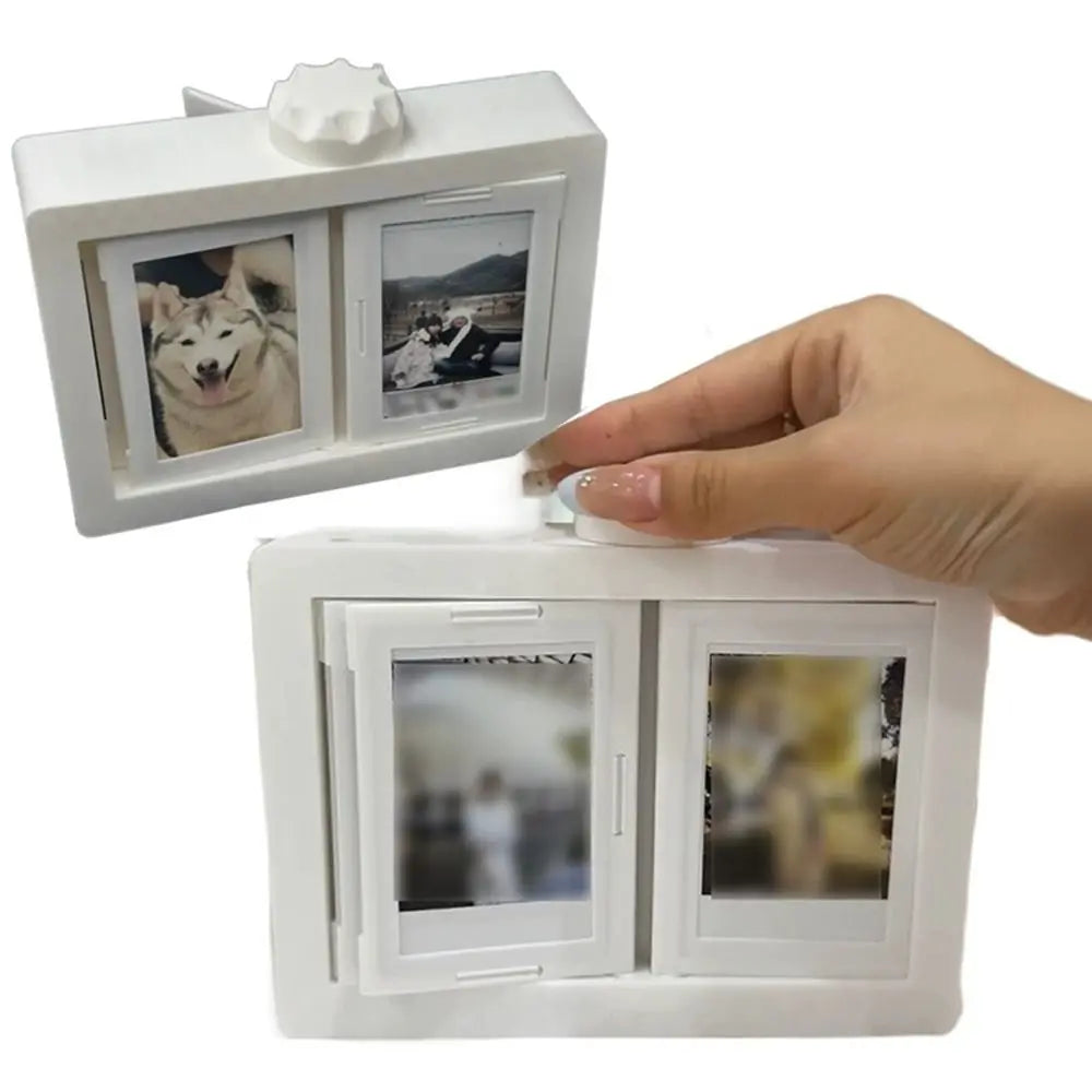 A white 3D rotating photo holder with two clear display pockets is shown being held by a hand.