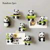 Random two panda fridge magnets featuring cute 3D pandas with green accents