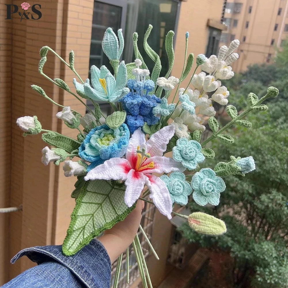Handmade crochet flower bouquet featuring light blue, white, and pink flowers and green foliage