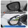 Carbon fiber rearview mirror rain guard installed on a vehicle, showing clear visibility.