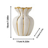 A white ceramic flower vase with gold accents, shaped like a stylized tulip, shown from the front.