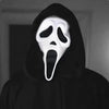 A realistic ghost face mask with a white, menacing expression is shown against a dark background.