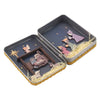 A rectangular tin box for a nativity scene decoration featuring hand-painted figures and straw-like details.