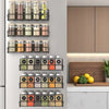 A black magnetic spice rack with multiple glass jars filled with various spices is mounted on a white refrigerator door.