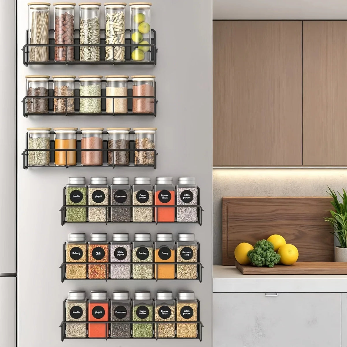 A black magnetic spice rack with multiple glass jars filled with various spices is mounted on a white refrigerator door.