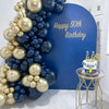 A balloon arch featuring metallic gold and navy blue balloons for a 50th birthday celebration.