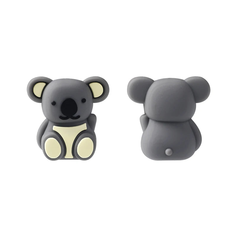 A pair of gray silicone bear-shaped plant beads for jewelry making and DIY crafts.