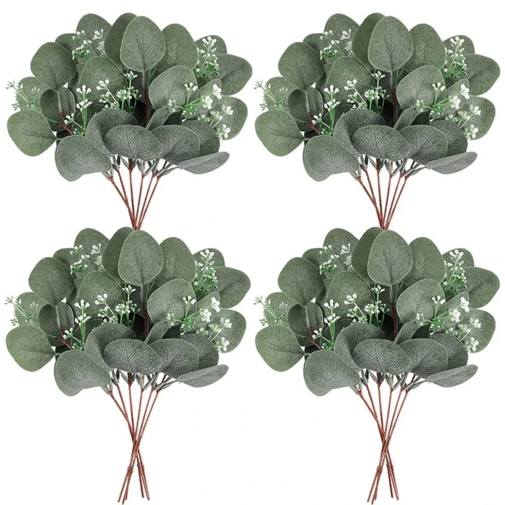 Green eucalyptus leaves with small white flowers on brown stems for vase decor and wedding arrangements
