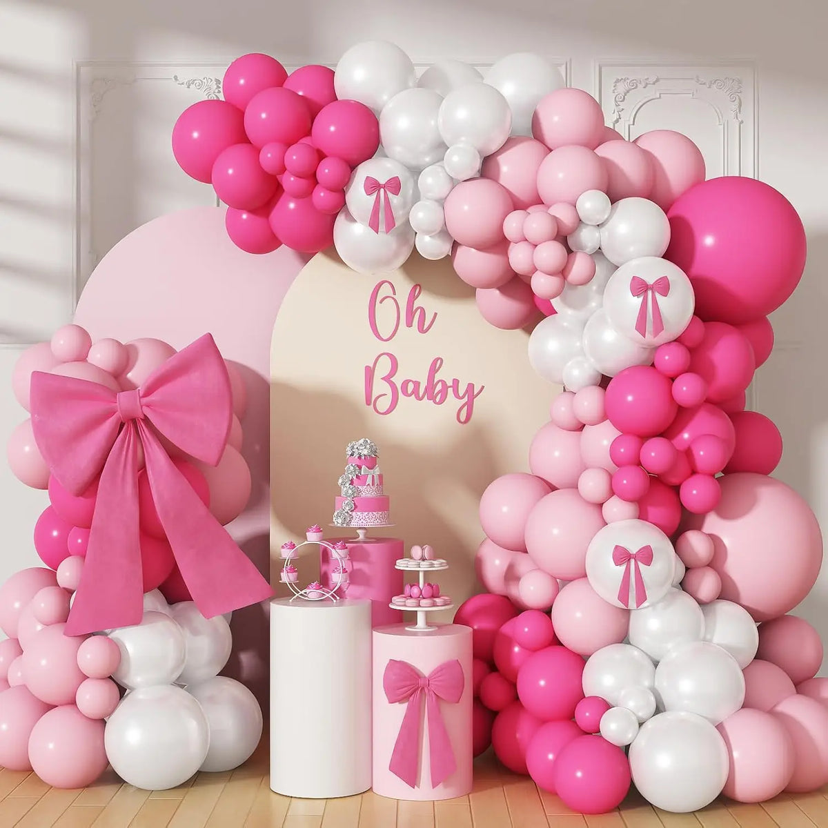 A large balloon arch decoration set featuring pink and white balloons for a baby shower or party.