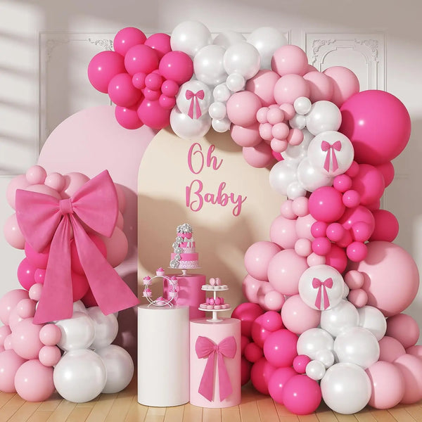 A large balloon arch decoration set featuring pink and white balloons for a baby shower or party.