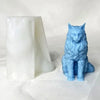 A light blue silicone mold shaped like a sitting cat is displayed next to a white, translucent object.