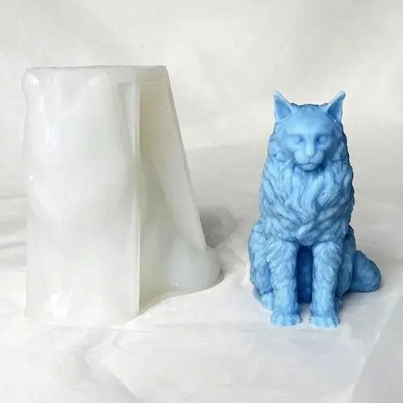 A light blue silicone mold shaped like a sitting cat is displayed next to a white, translucent object.