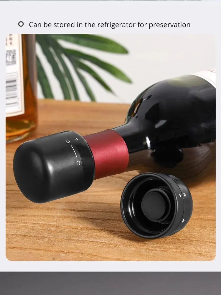 A black silicone wine bottle stopper is shown next to a glass bottle on a wooden surface.