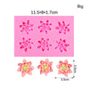 Pink silicone molds shaped like lotus flowers for cake decorating