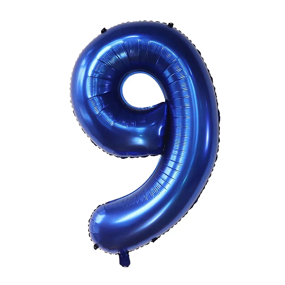 A large, dark blue foil number balloon shaped like the numeral 9 for party decor.